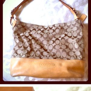 Authentic Coach Purse with classic “C” logo.